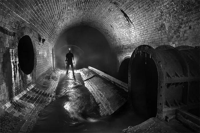 Person in a dark, foreboding tunnel